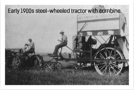 Early 1900s steel wheeled tractor with combine